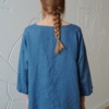 Back of an oversized linen top with three-quarter sleeves