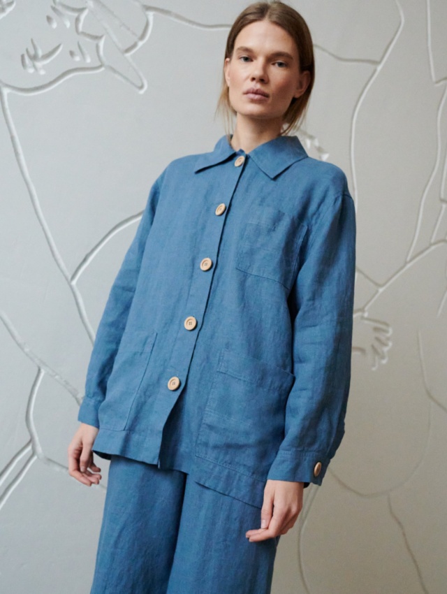 A blue relaxed fit linen jacket with wooden buttons