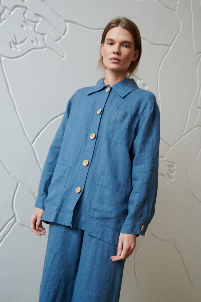 A blue relaxed fit linen jacket with wooden buttons