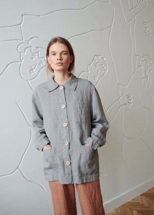 Linenfox model in an oversized linen jacket with patch pockets and wooden buttons