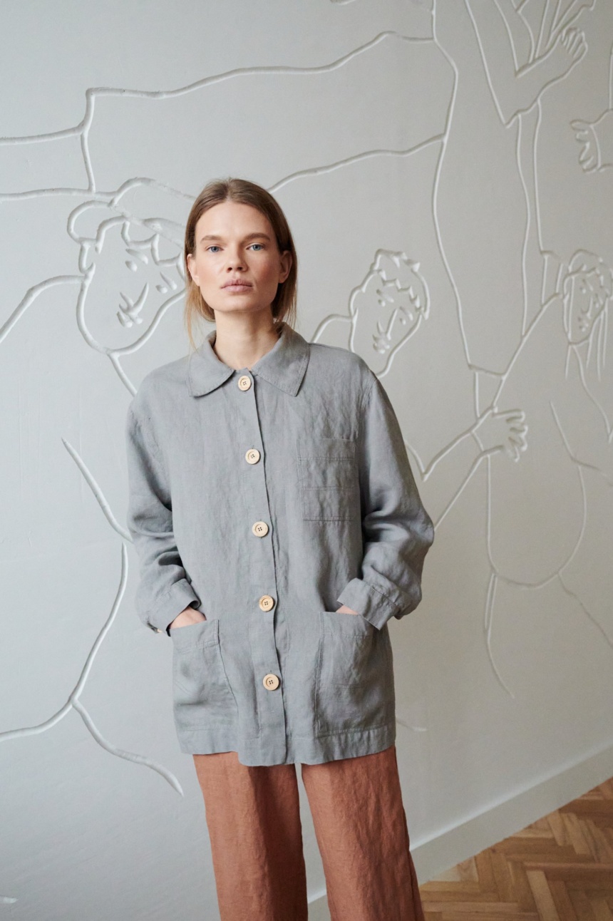 Linenfox model in an oversized linen jacket with patch pockets and wooden buttons