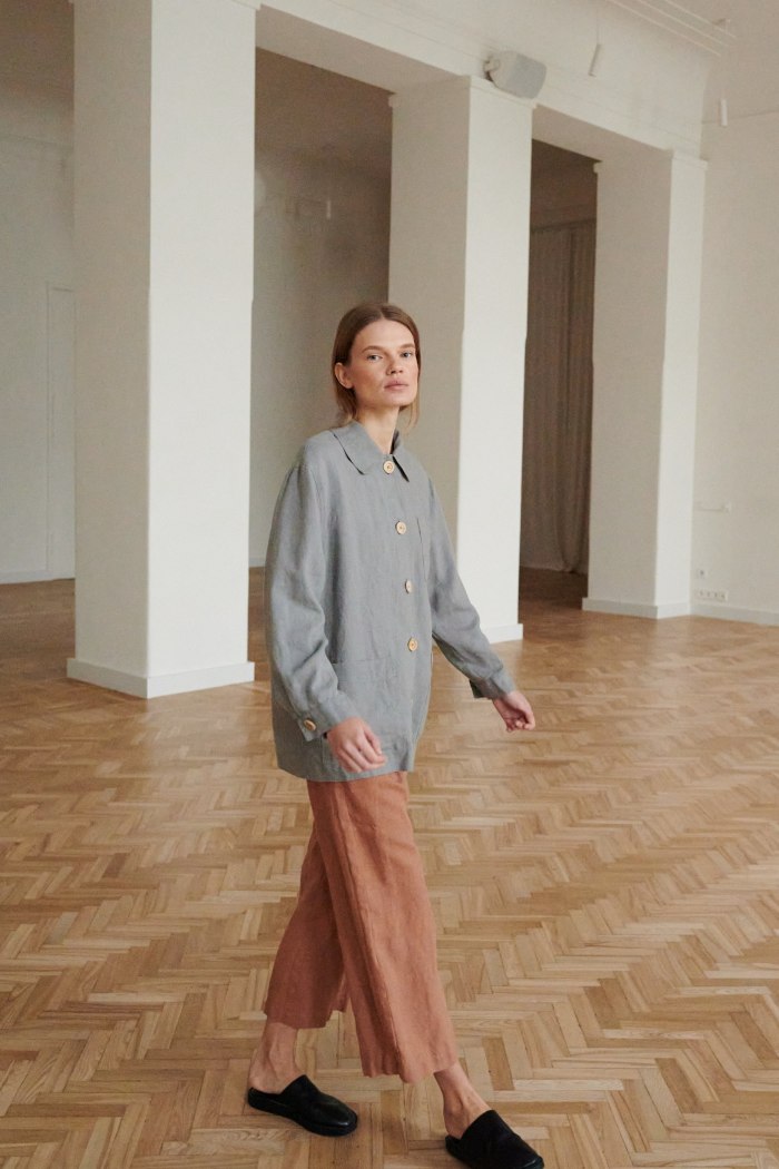 A loose-fitting grey linen jacket and wide-leg linen pants outfit