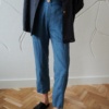 Blue high-waisted linen pants with a decorative button