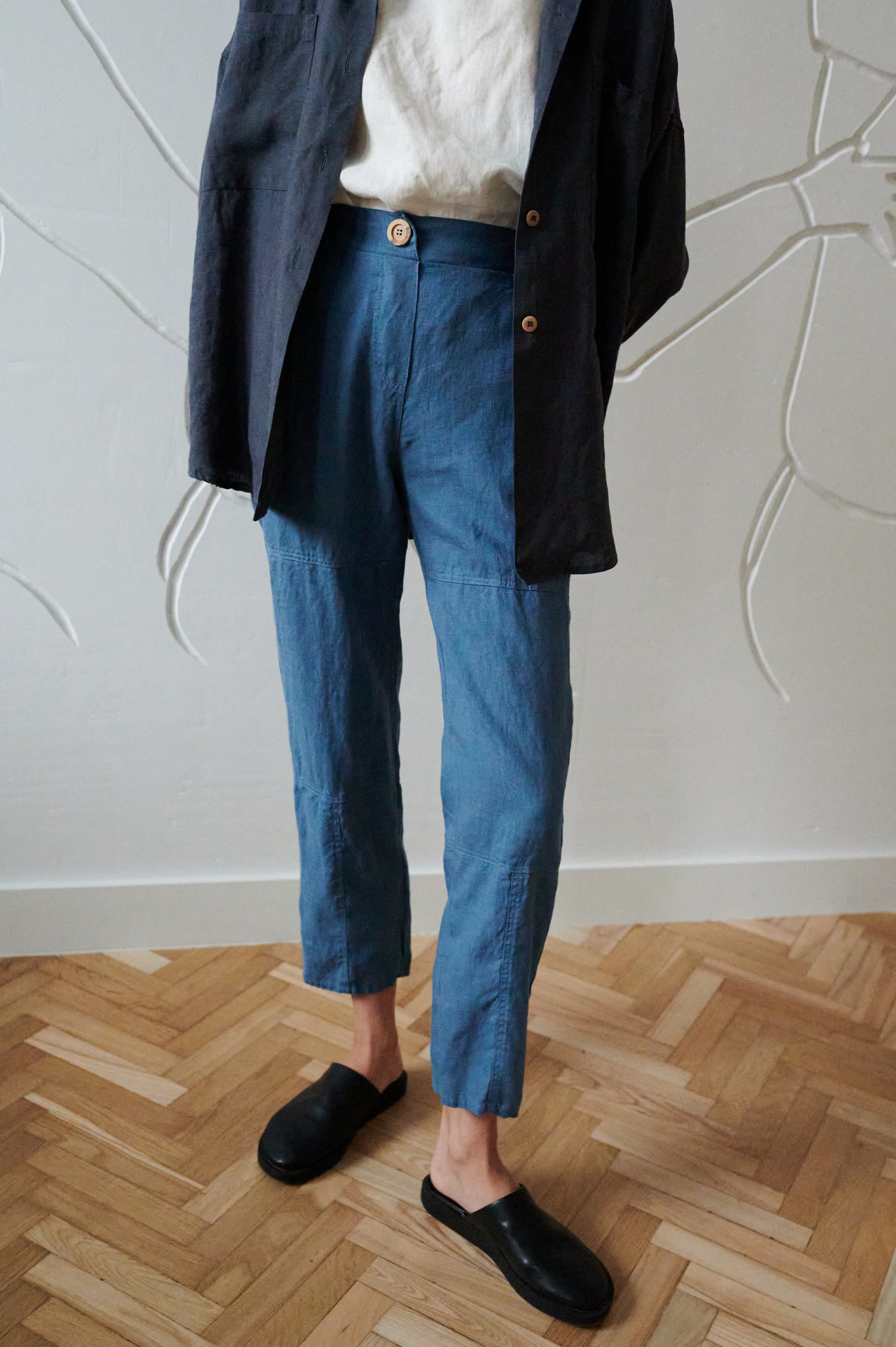 Blue high-waisted linen pants with a decorative button