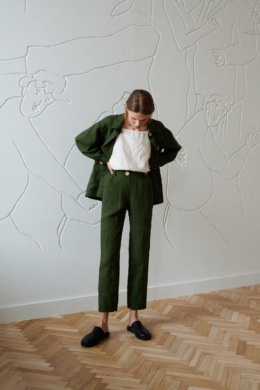 Cropped high-waisted linen pants worn with a linen summer top and an unbuttoned linen jacket on top
