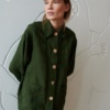 An oversized green linen jacket with wooden buttons