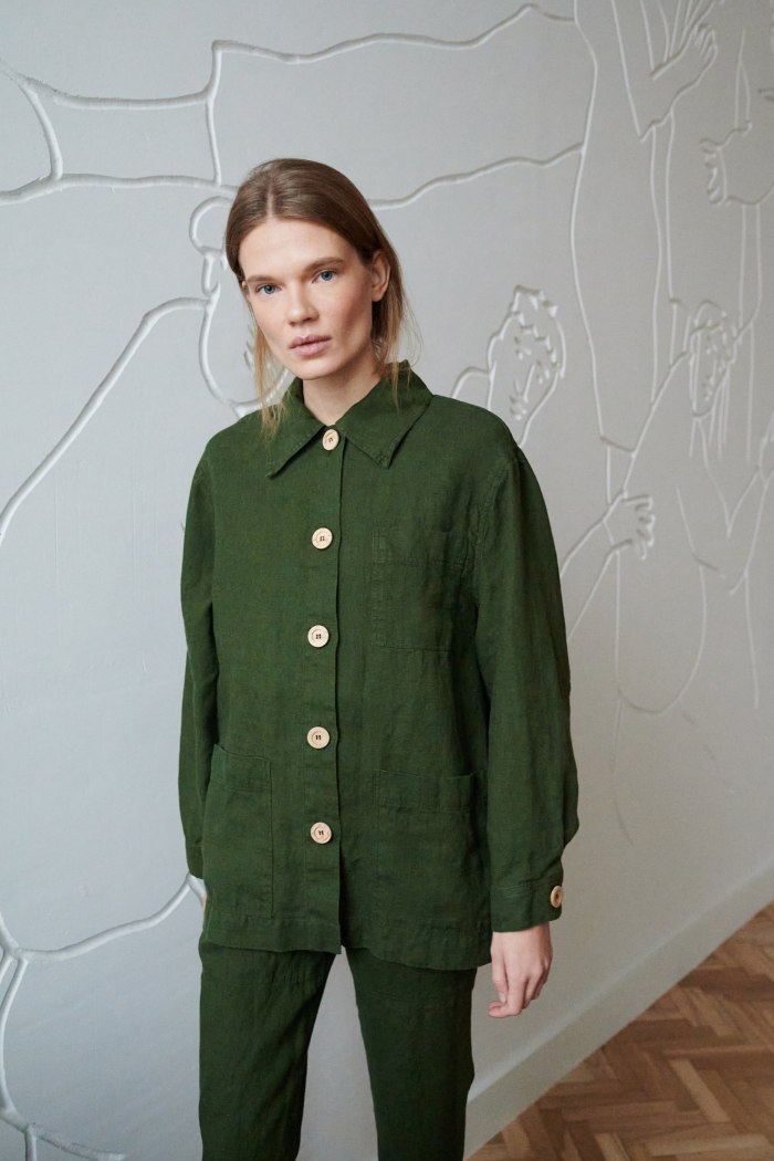 A loose-fitting linen button-down jacket with wooden buttons