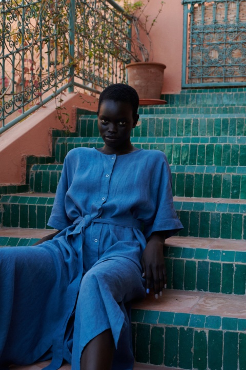 model wearing an oversized blue linen dress