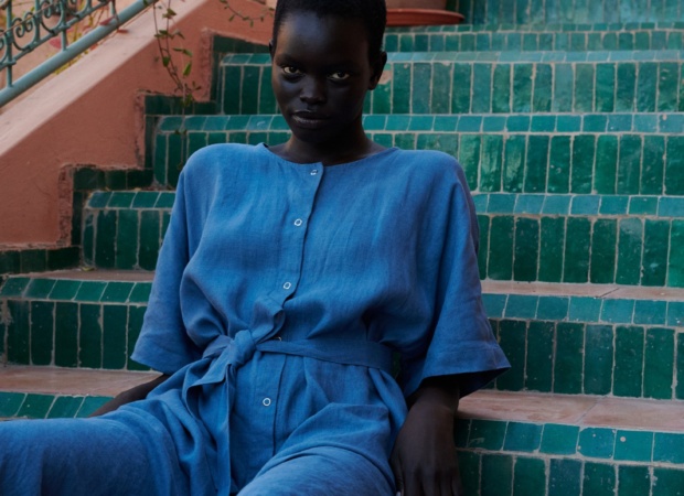 model wearing an oversized blue linen dress