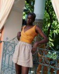 women is wearing wide leg grey linen shorts