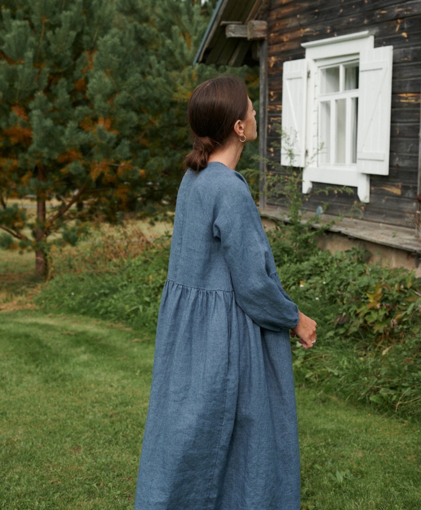 a woman in margo linen wool blend dress in blue