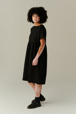 model wearing timeless black linen dress
