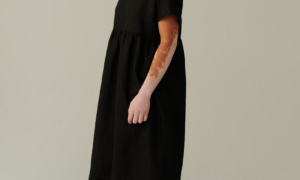 model wearing timeless black linen dress