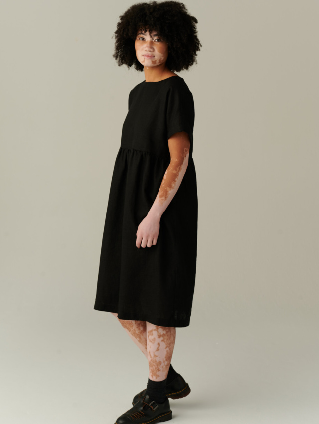 model wearing timeless black linen dress