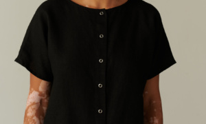 Relaxed fit black linen top with snap buttons