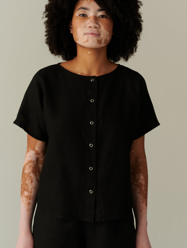 Relaxed fit black linen top with snap buttons