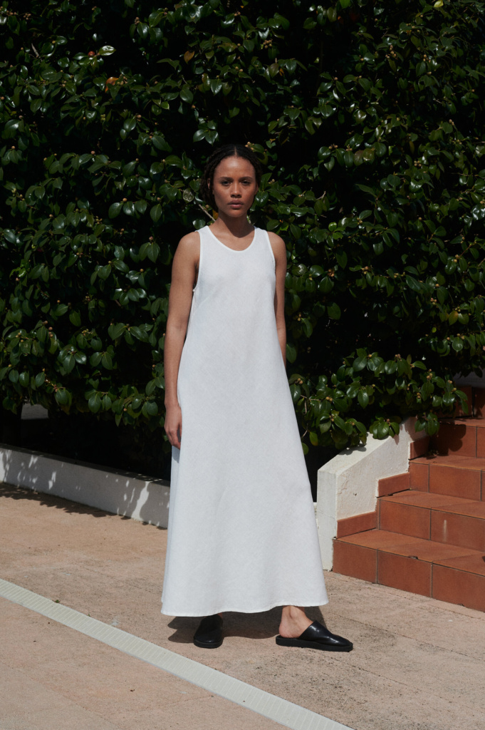 Front view: Alba medium-weight linen dress in milky white, round neckline and relaxed A-line fit, perfect for summer layering.
