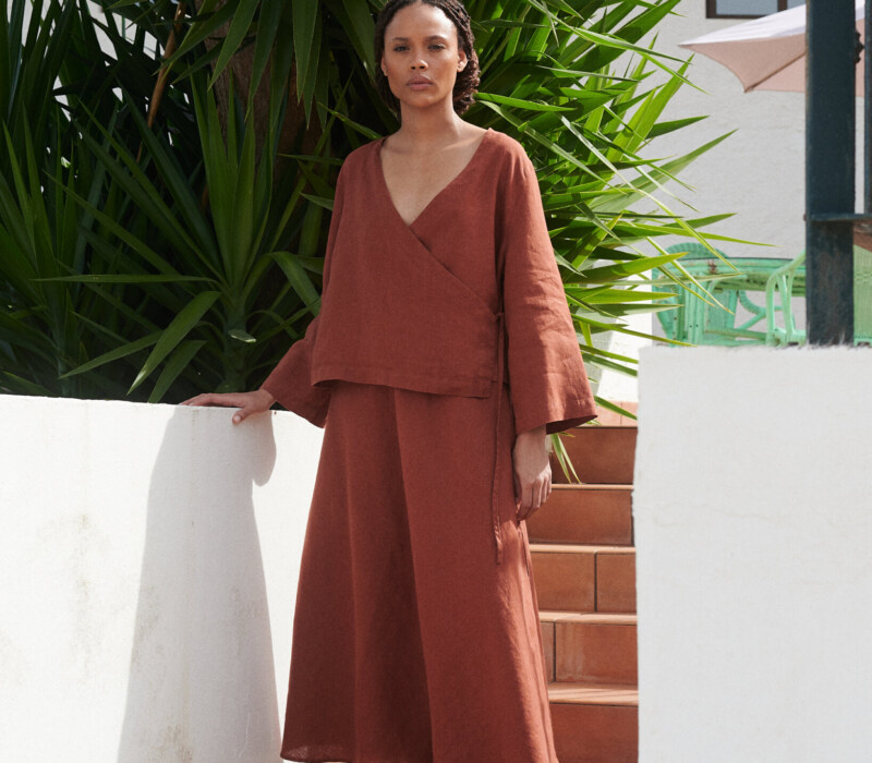 women is wearing summer linen skirt in terracotta color