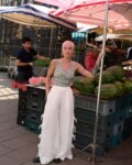 women is wearing white linen side tie pants