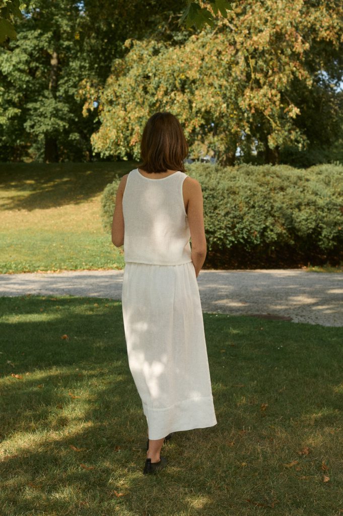 Back view of the Sadie top – milky white sleeveless linen blouse designed for layering in a linen minimalist wardrobe.