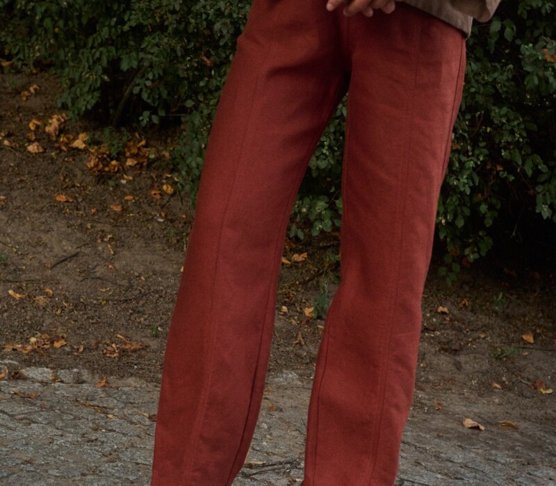 model is wearing tailored heavy linen trousers