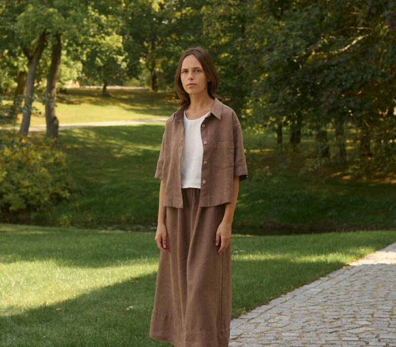 model is wearing brown linen skirt