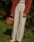 women is wearing a structured heavy linen trousers