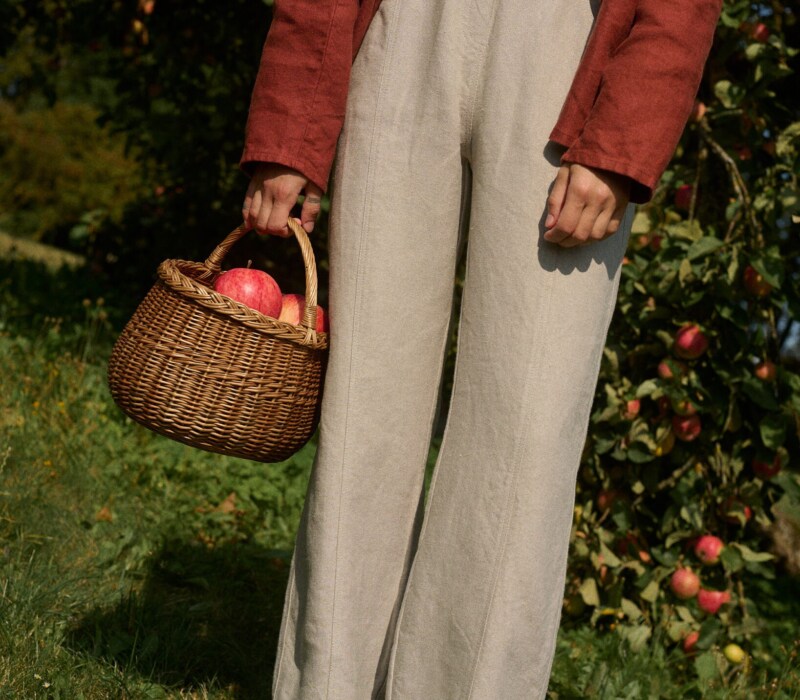 women is wearing a structured heavy linen trousers