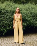 Butter linen two-piece set featuring a wrap crop top and wide-leg trousers, breathable women’s linen outfit