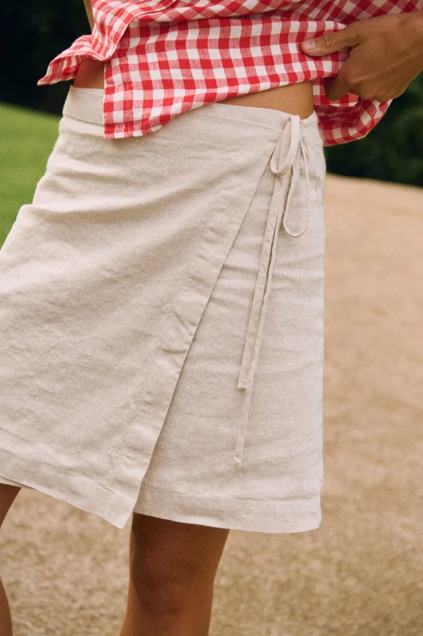 White cotton-linen blend mini wrap skirt with adjustable waist ties