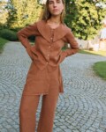 Front view of mocha mousse linen blouse with statement collar and relaxed fit, styled with matching linen pants with an overskirt