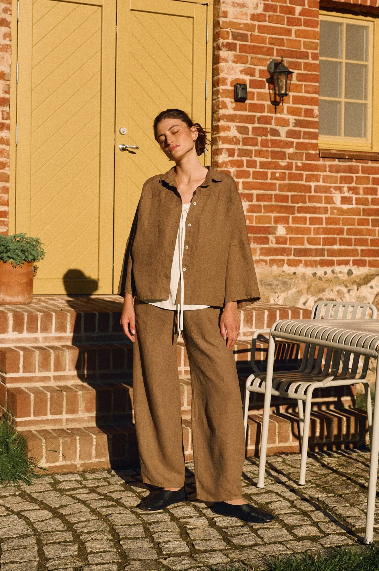 Cacao oversized linen shirt with shell buttons styled with matching high-waisted trousers