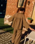Cacao linen shirt with ruffled gathered back and relaxed oversized fit, back view
