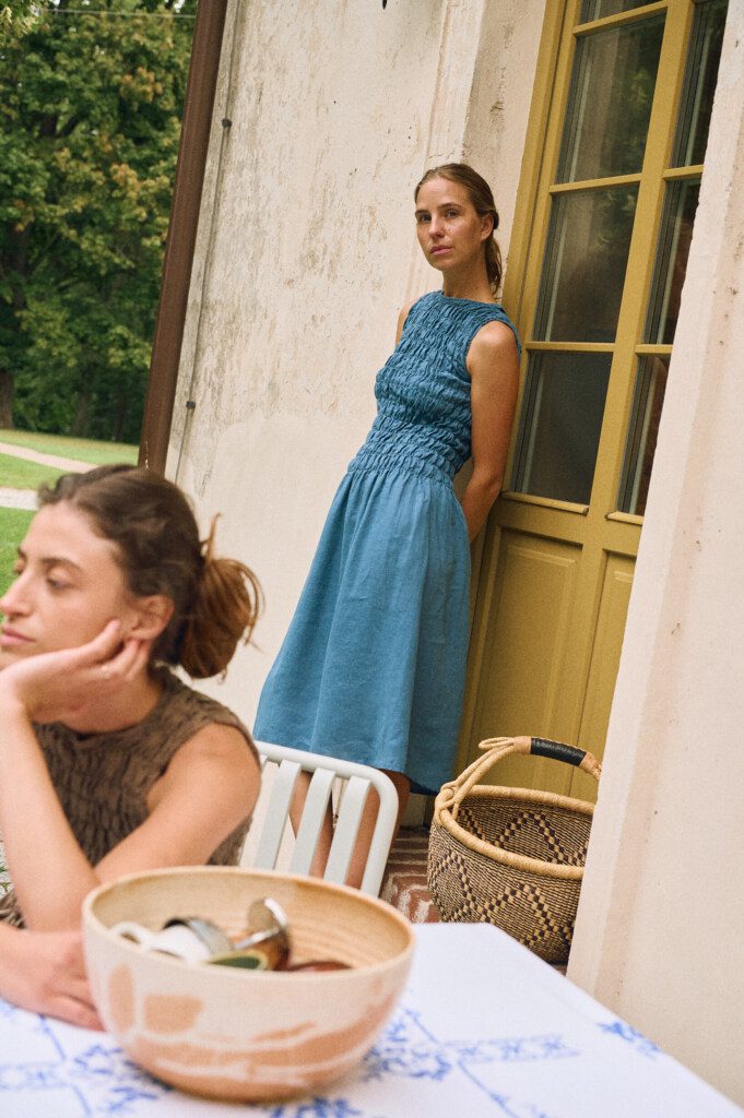 Two women wearing linenfox most popular linen dresses in stellar blue and cacao colors.
