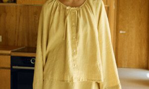 Butter linen two-piece outfit with balloon sleeve blouse and flared mini skirt