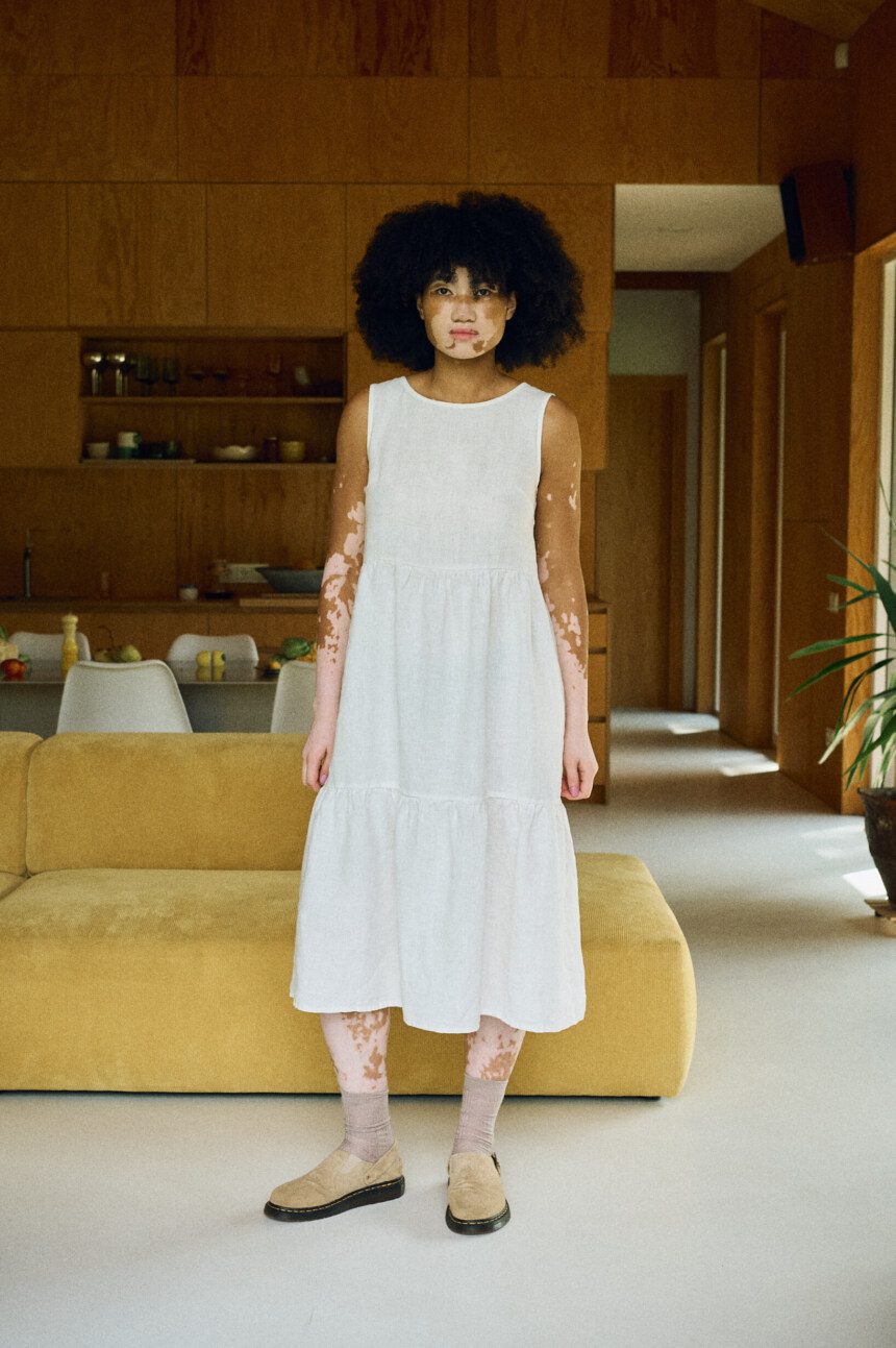 Front view of the Amalie midi linen dress, showcasing its A-line silhouette and tiered skirt