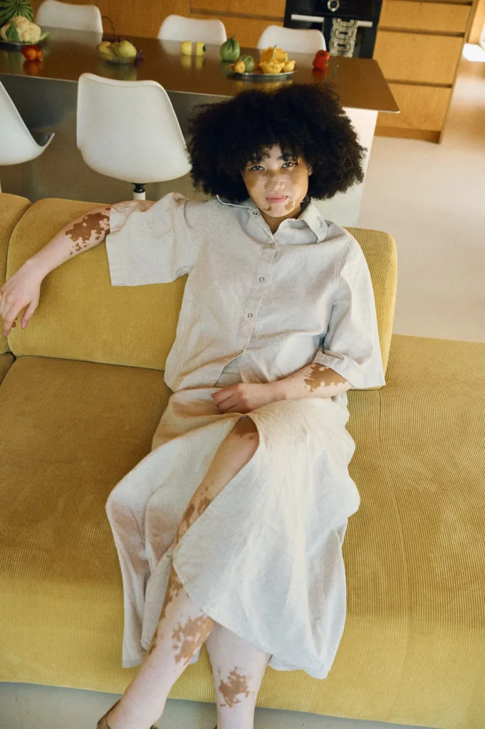 Relaxed linen-cotton ensemble featuring a short-sleeve button-up shirt paired with a high-waisted midi skirt with a front slit