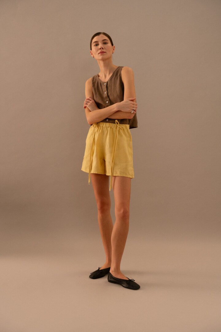 Cacao linen sleeveless top styled with butter linen drawstring shorts in relaxed fit