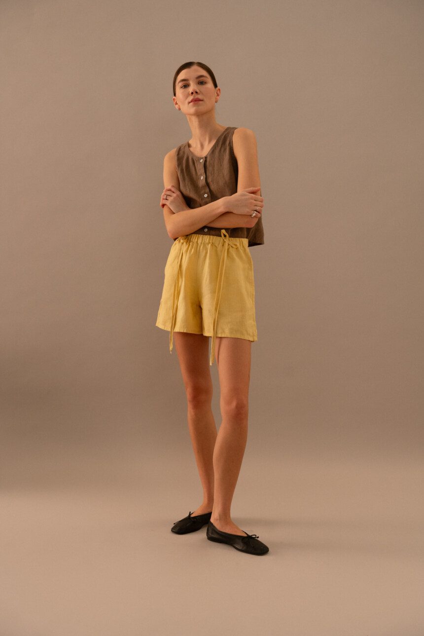 Cacao linen sleeveless top styled with butter linen drawstring shorts in relaxed fit
