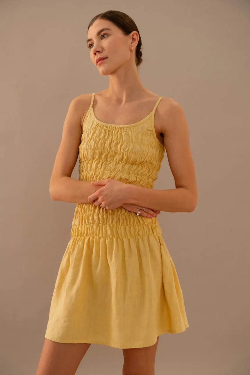 smocked mini linen dress in butter yellow color
