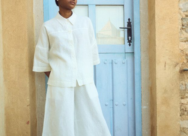oversized white linen shirt styled with wide linen culottes