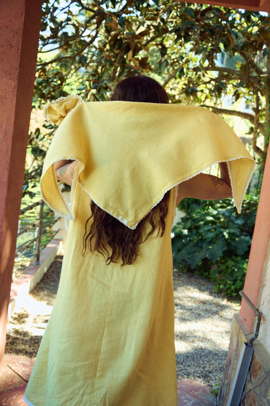 Yellow linen lace bandana tied on head with delicate lace trim edges