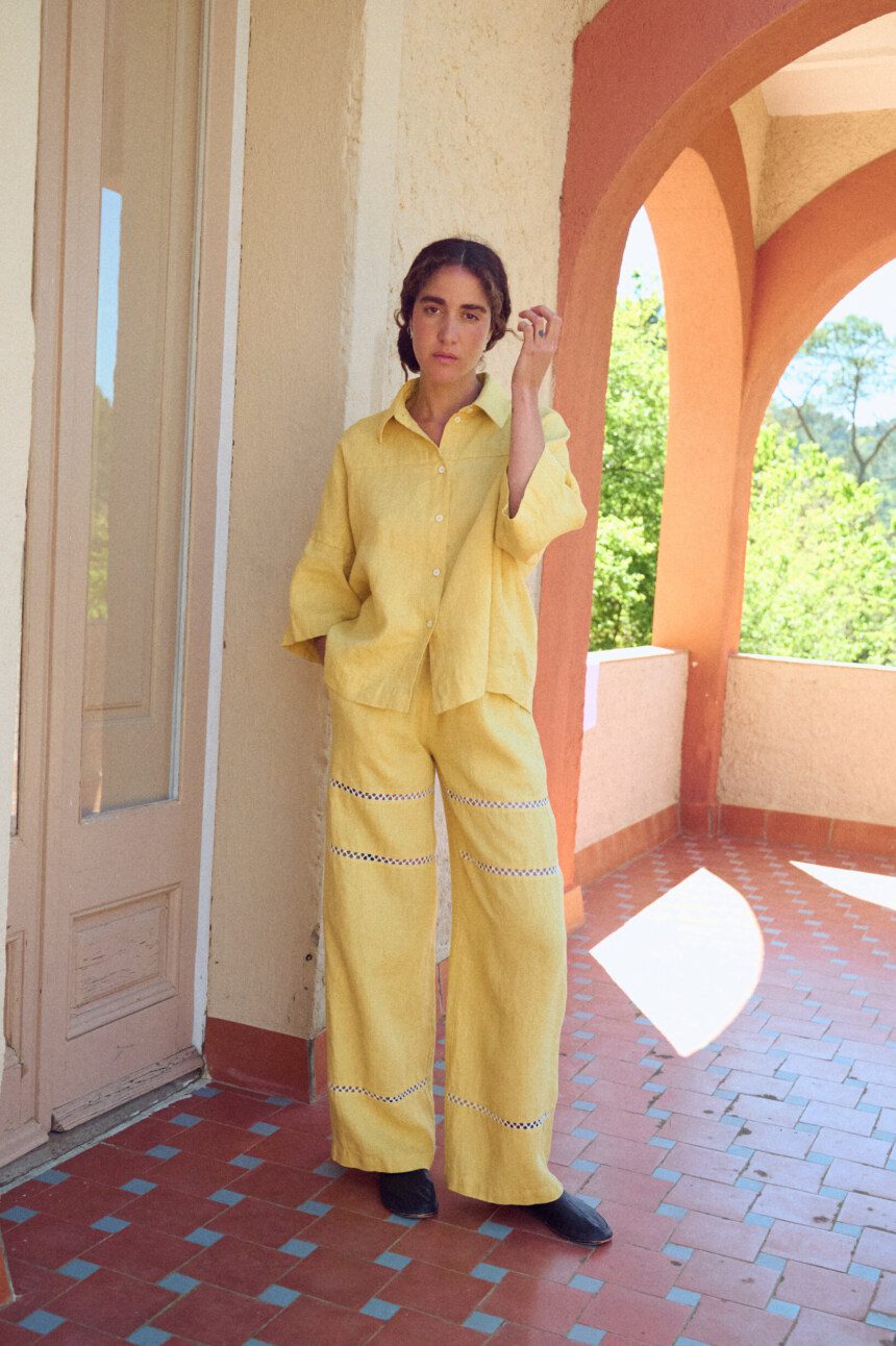 Summer linen pants in a long wide leg silhouette with lace inserts and side pockets