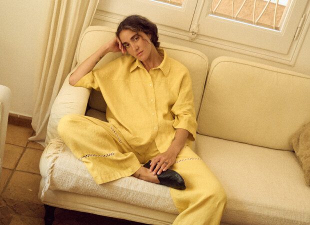 Relaxed yellow linen set featuring wide-leg pants with delicate lace inserts and an easy button-up shirt, styled for effortless everyday wear