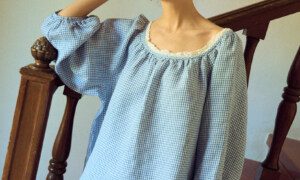 Blue gingham blouse with raglan sleeves and lace neckline