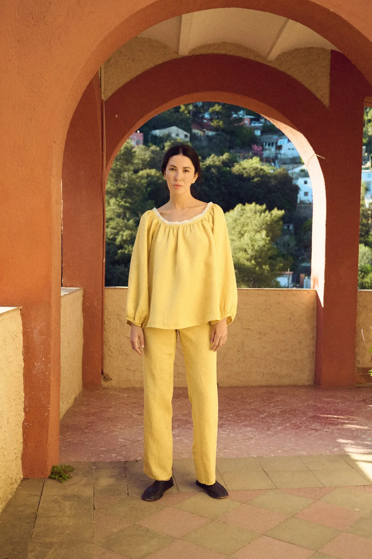 butter yellow straight pants with lace details and drawstring waist styled with matching blouse
