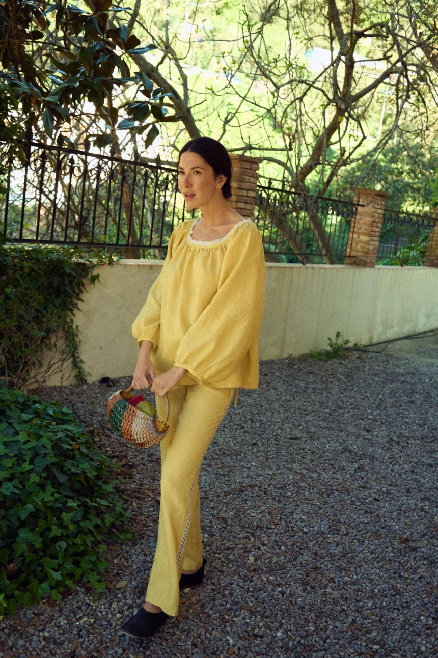 Straight fit linen drawstring trousers with side ties and lace detail. Minimal design without pockets.