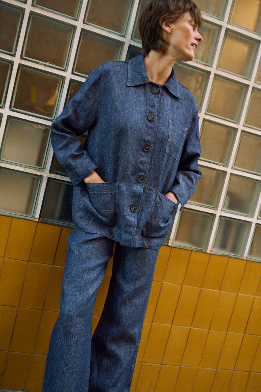Blue denim linen jeans with wide legs, paired with a matching button-front linen jacket with patch pockets