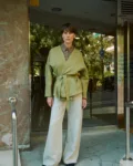 Natural grey heavy linen wide-leg trousers styled with an olive green wrap jacket and brown linen shirt