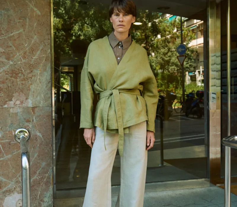 Natural grey heavy linen wide-leg trousers styled with an olive green wrap jacket and brown linen shirt